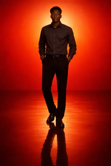 Lone Silhouette in an Orange-Red Gradient